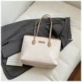 Cream white oversized tote bag featuring embossed cartoon patterns and brown handles - Beige/Khaki