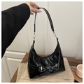 Fashionable black patent leather hobo shoulder bag with stylish silver metal buckle detail - Black
