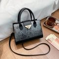 Chic black and grey python print tote bag with a golden triangular turn-lock closure - Black