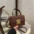 Dark brown leather crossbody square bag with elegant gold geometric buckle and chain - Brown