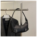 Detail of black crescent hobo bag with silver buckle straps and adjustable shoulder strap - Black