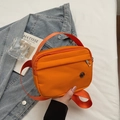 Bright orange nylon crossbody bag with wide shoulder strap and double zipper pockets - Orange