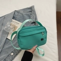 Sporty mint green nylon crossbody bag with multi-layer zippers and adjustable strap - Green