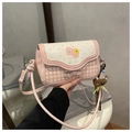 Detailed view of pink plaid crossbody bag with bow decoration and bear plush charm - With Charm / Sakura Pink