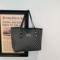 Black tote bag with M-letter monogram print and golden bow clasp for daily commute - Black