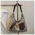Detail of grey marble canvas tote bag with brown PU leather straps and zippered pocket - Gray