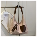 Detail of a large tote bag featuring beige fabric and brown leather patchwork design - Pink