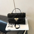 Chic black crossbody bag with pleated texture, gold buckle lock and top handle strap - Black