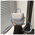 Detail of blue and white PU leather handbag featuring cute cherry print and gold hardware - Blue