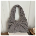 Close-up of gray corduroy tote bag featuring a large decorative bow and heart print patterns - Gray