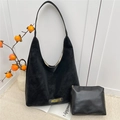 Black minimalist hobo shoulder bag set with a matching pouch and gold brand lettering - Black