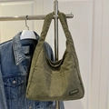 Olive green corduroy tote bag with fashion label and textured vertical stripes - Green