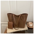 Macro detail of leopard print tote bag with brown leather handles and matching small pouch - Brown Leopard Style