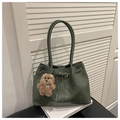 Detail of dark green tote bag with belt buckle accent and cute brown plush puppy charm - With Pendant / Green