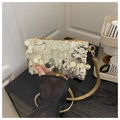 Close-up of glitter sequins crossbody bag with gold zipper and thin strap detail - Gold