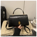 Glossy black leather crossbody handbag with gold twist lock and top handle - Black