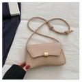 Close-up of minimalist beige baguette bag with a square golden metallic buckle clasp - Khaki