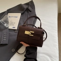 Mini trapezoid dark coffee pebbled leather handbag with gold metal lock and top handle - Brown