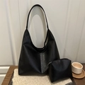 Large black PU leather tote bag with matching zipper pouch on a wooden table - Black