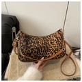 Chic leopard print shoulder bag with brown leather trim and a gold chain strap - Brown