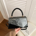 Fashionable black faux leather crossbody bag with silver snakeskin pattern flap - Black