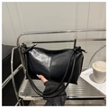 Minimalist black soft leather shoulder bag with vertical stitching and gold metal details - Black
