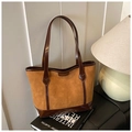 Close-up of embossed cat motif and letter texture on caramel faux suede tote bag - No Pendant / Brown