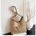 Minimalist beige hobo shoulder bag with buckle strap on a clean modern display - Khaki