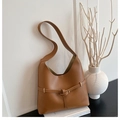 Minimalist tan leather hobo bag with a decorative buckle strap and wide shoulder strap - Brown