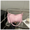 Minimalist light pink leather baguette bag with knotted strap and gold hardware accents - Pink