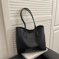 Borsa tote minimalista in pelle nera opaca con scritte dorate e cuciture geometriche - Nero
