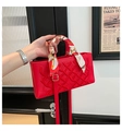 Elegant red leather crossbody bag with embossed texture and decorative silk scarf handle - Red