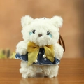 Plush teddy bear charm wearing a navy floral dress with a vibrant yellow silk bow - Yellow Bow
