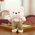 Cute pink plush bear wearing brown overall trousers with decorative buttons - Pink