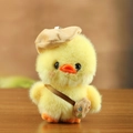 Cute yellow plush duck toy with a brown beret and mini artist bag on wooden table - 13cm / Yellow