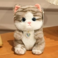 Close-up of fluffy grey striped plush cat toy with a pearl heart pendant and blue eyes - About 15cm / Civet Cat