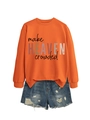 Flat lay of an orange 'make HEAVEN crowded' sweatshirt paired with ripped denim shorts - Orange (Black Print)