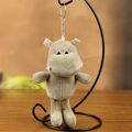 Cute light khaki hippo plush keychain with pink ears on a metal display stand - Hippo