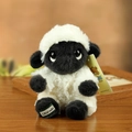 Cute black face sheep plush toy with white fluffy fur and branded tags on wooden table - F Little Sheep Pendant / 17cm (Including Lanyard)