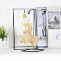 Close-up of a fluffy brown alpaca plush keychain with a checkered bow on a metal ring - Height / Tan