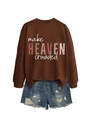 Detail of Make Heaven Crowded brown sweatshirt paired with distressed denim shorts - Coffee (White Print)