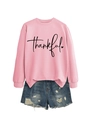 Close-up of the thankful script embroidery and soft knit fabric on this pink sweatshirt - Pink (Black Text)