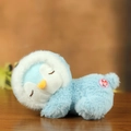 Plush penguin toy in light blue sleep posture with soft white fur and embroidered eyes - Blue Penguin