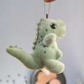 Primer plano detallado del llavero de dinosaurio de peluche verde con cadena de bolas - verde claro / Aproximadamente 12cm