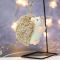 Detail of cute hedgehog plush keychain featuring soft brown faux fur and a gold metal clip - Height about 11 / Short-Legged Brown