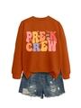 Flat lay of Pre-K Crew rust orange sweatshirt and distressed denim shorts outfit set - S / Pre-K Crew Graphic / Burnt Orange