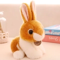 Plush brown and white rabbit toy sitting in a warm home setting, soft faux fur texture - 20cm / Brown