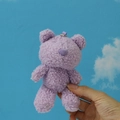 Close-up of a soft purple teddy bear plush keychain with curly fleece texture - 12cm / Purple