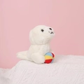 Close-up of white plush seal toy holding a colorful striped ball on pink background - 12cm / Sea Lion