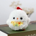 Cute white plush chick keychain toy with lace floral bib on a green book - Approx 10cm / White